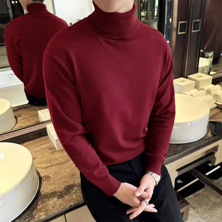 Closeup of a mens crew neck cashmere blend knit sweater in rich red, showcasing luxury texture.
