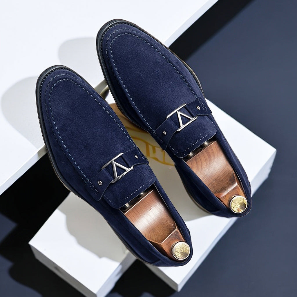Slip-on men's dress shoes: vegan suede loafers featuring a stylish buckle detail.