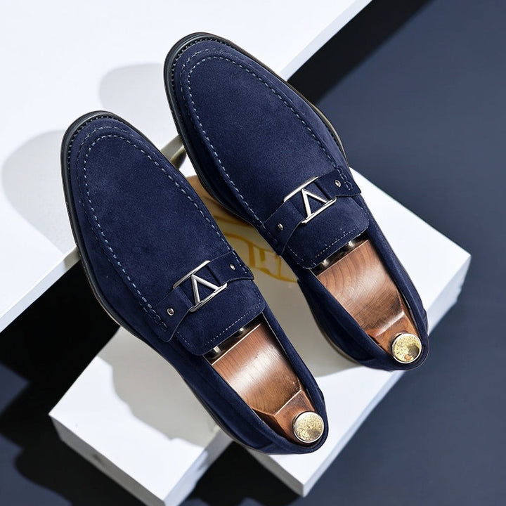 Slip-on men's dress shoes: vegan suede loafers featuring a stylish buckle detail.