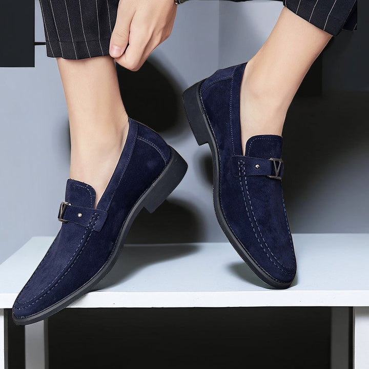 Close-up of men's vegan suede loafers, showcasing the sophisticated buckle and slip-on design.