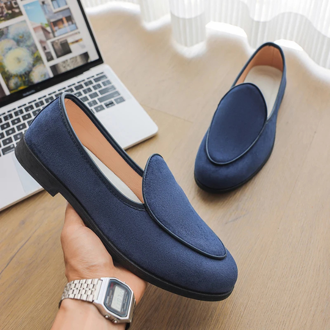 Close-up of Men's Midtown loafers, showcasing the premium suede texture and slip-on design