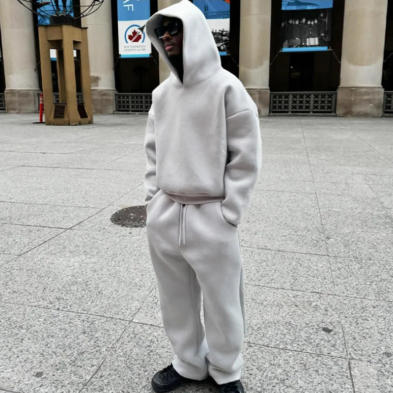 Men's minimalist hooded sweatshirt and track pants set in gray, ideal for casual loungewear
