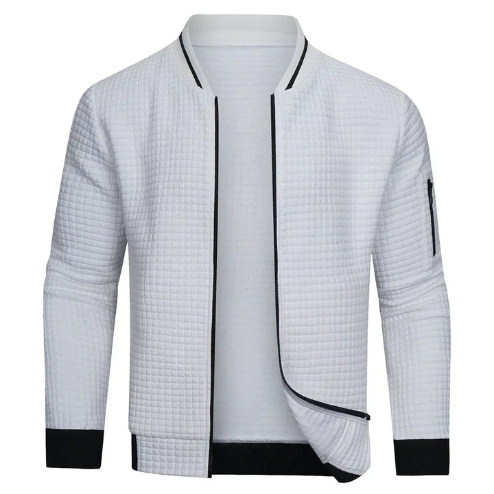 Man wearing a men's full-zip textured grid cardigan. Perfect for effortless layering, casual or smart-casual occasions.