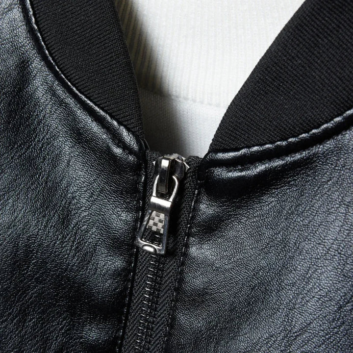 Full shot of a man wearing a modern leather bomber jacket, suitable for various outfits.