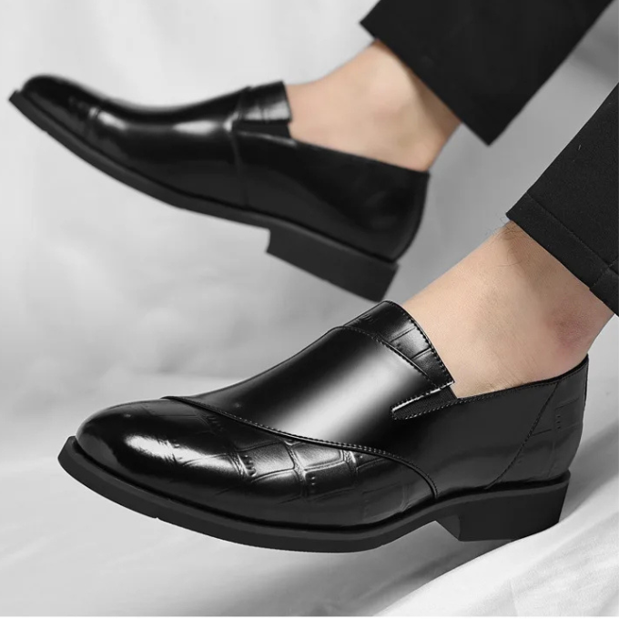 Overhead shot of men's modern European-style leather slip-on loafers, highlighting minimalist design