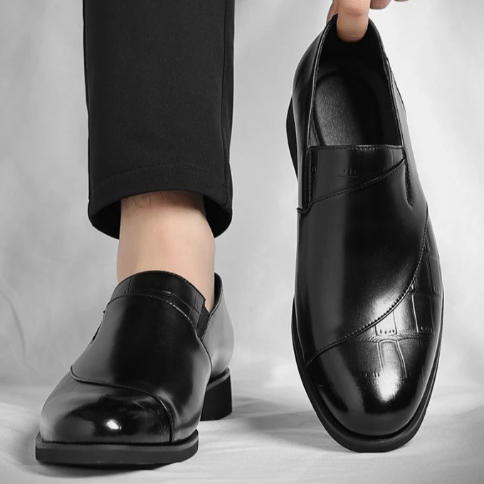 Interior view of a men's leather slip-on loafer, showing soft lining for enhanced comfort