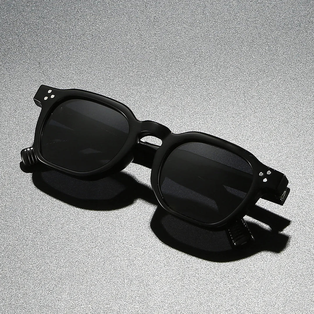 Close-up of men's acetate block frame sunglasses, offering UV400 lens protection