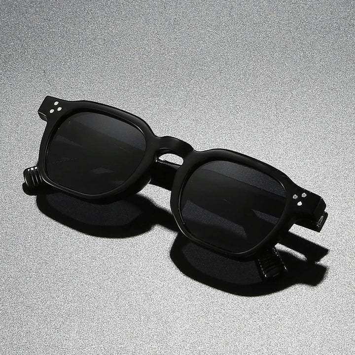 Close-up of men's acetate block frame sunglasses, offering UV400 lens protection