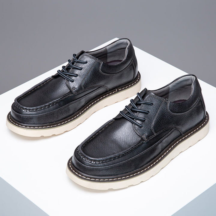 Men's grey casual boots displayed in a retail setting, highlighting their popularity