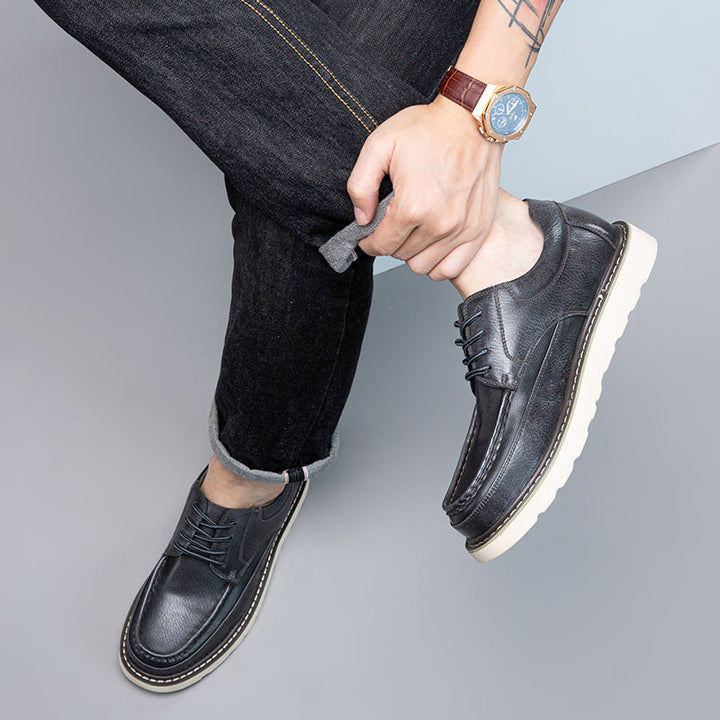 Men's brown casual boots with a slight heel, offering a dressier touch to casual footwear