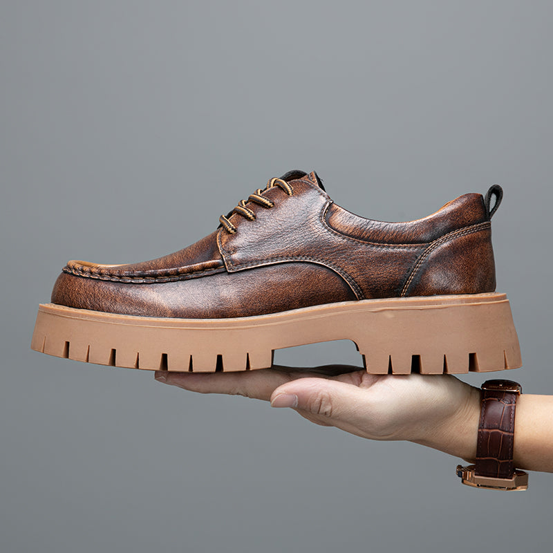 Men's grey casual boots with a clean, minimalist design, emphasizing comfort and style