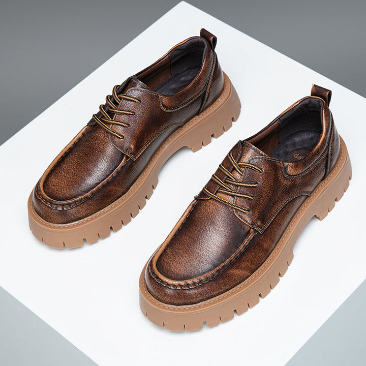 Men's grey casual boots paired with khaki trousers, a smart-casual footwear choice