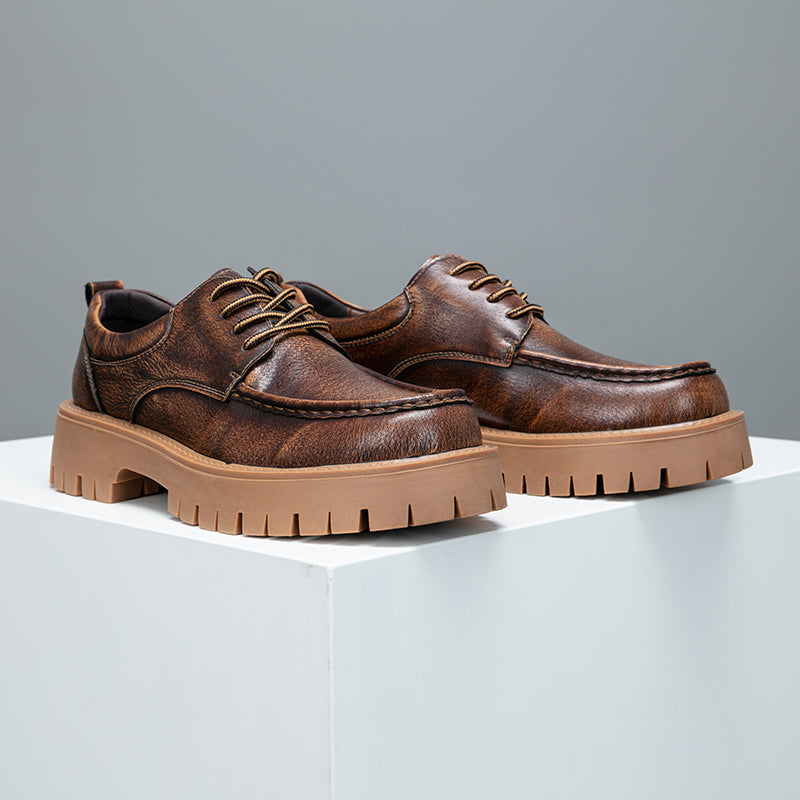 Indoor shot of men's brown modern casual boots, highlighting their versatile style