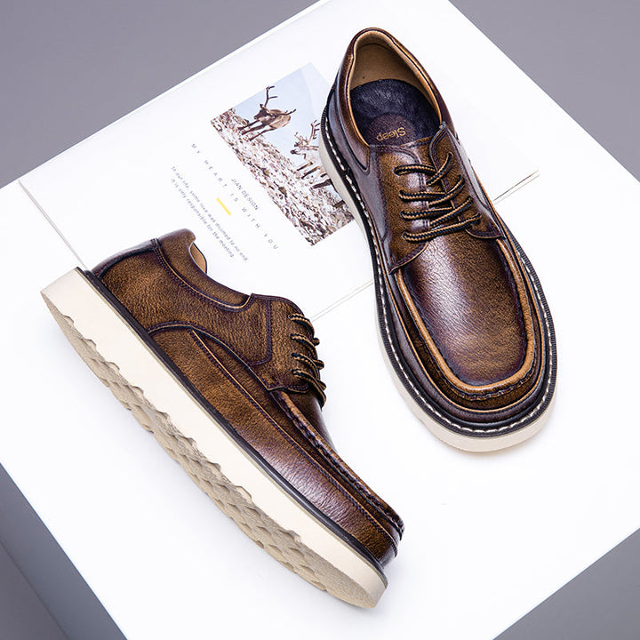 Pair of men's modern casual brown boots, ideal for smart and relaxed outfits