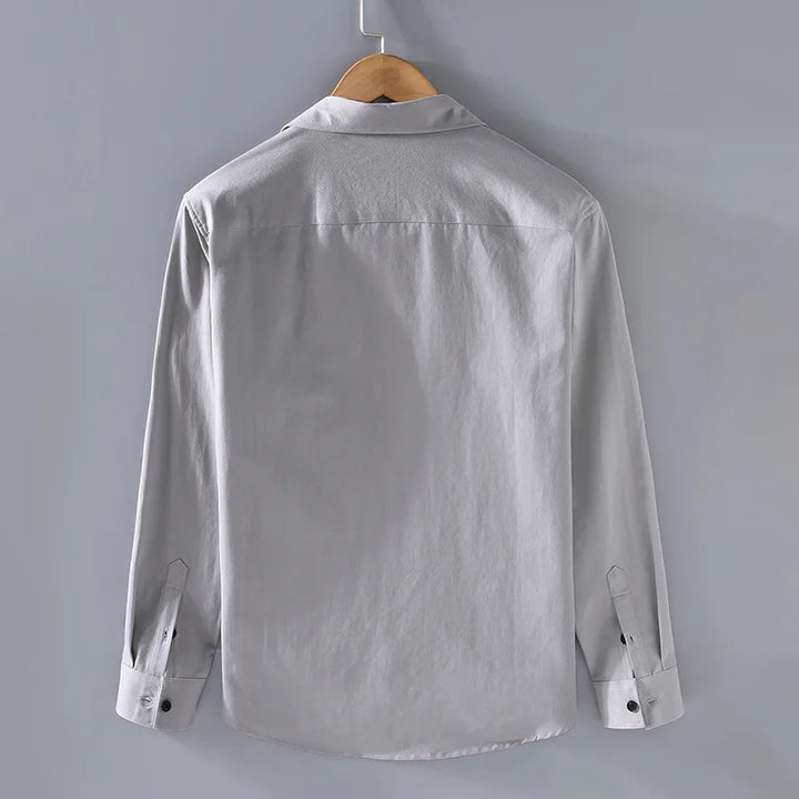 Detail of the fabric texture on a grey men's modern fit casual button-down shirt