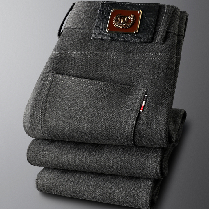 Khaki men's tailored trousers laid flat, displaying the clean lines and refined cut perfect for any occasion.