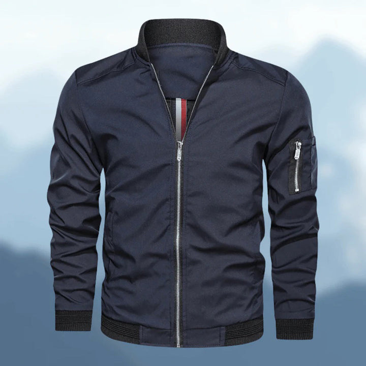 Stylish men's bomber jacket, slim fit, black with ribbed cuffs and collar, side pose