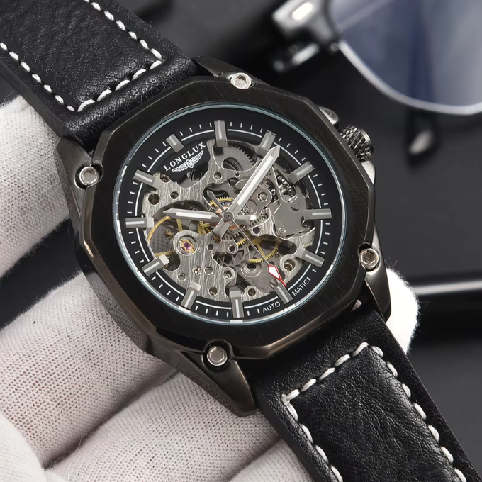 Wrist shot of a man wearing an octagonal skeleton watch with a comfortable brown cowhide band.