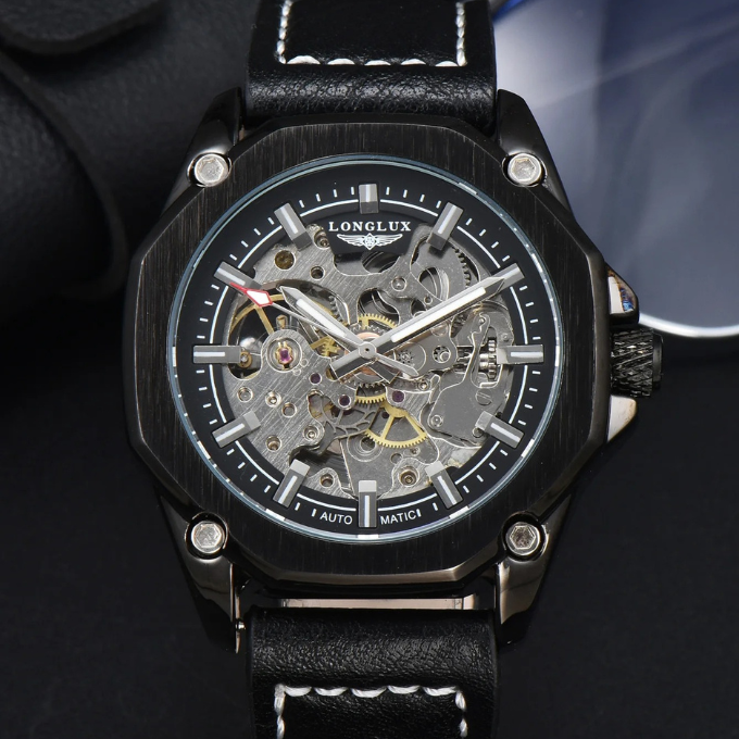 Close-up of the buckle on the brown cowhide strap of a men's octagonal skeleton dial watch.