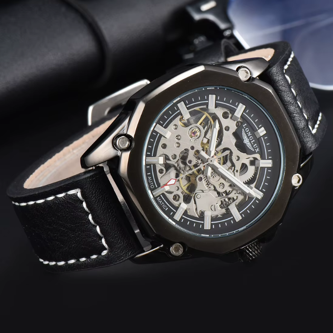 Detailed view of the crown and watch case engravings on a men's octagonal mechanical timepiece.