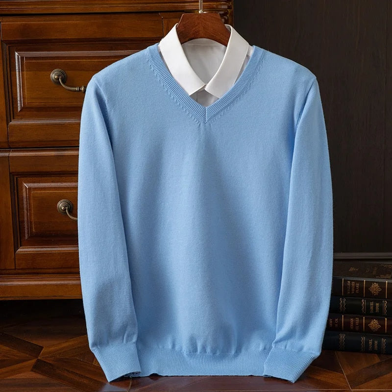 Stylish men's V-neck pullover sweater in deep blue. Perfect for versatile layering and men's fashion.