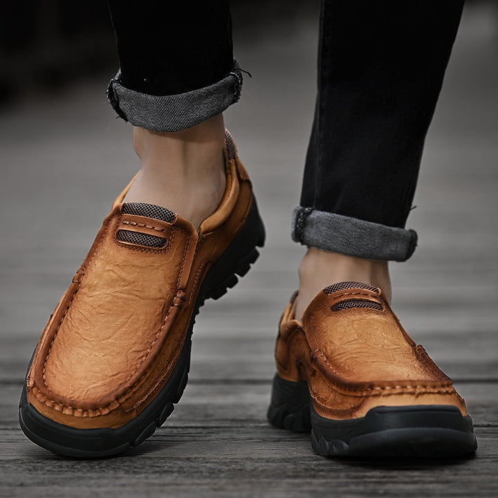 Khaki orthopedic men's boots, comfortable for outdoor activities, leather and posture-correcting design.