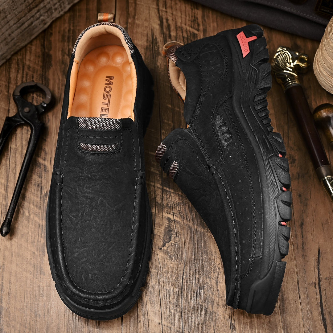 Men's brown orthopedic boots, comfortable sole, in a natural light setting, highlighting material.