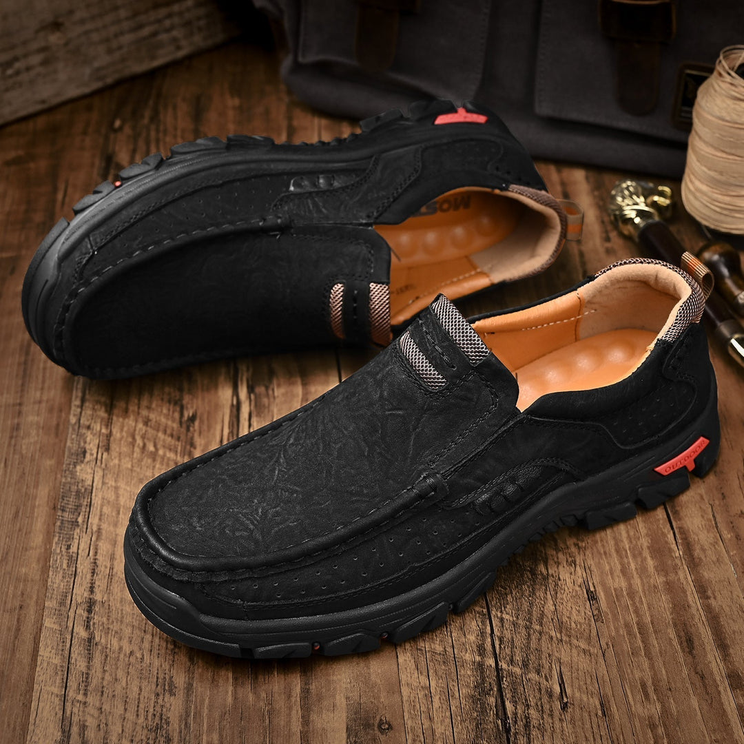 Black orthopedic men's boots, comfortable design for posture correction, suitable for office.