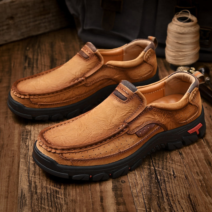 Profile shot of black orthopedic men's boots, comfortable sole, high ankle, slip-resistant outsole.