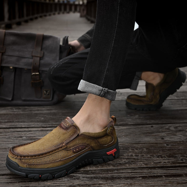 Men's brown orthopedic boots, comfortable sole, shown in an indoor setting, leather, posture.