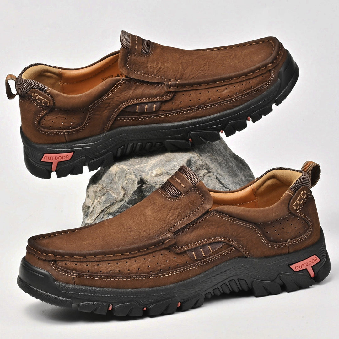 Men's brown orthopedic boots, comfortable, showcasing rich leather texture and durable construction.