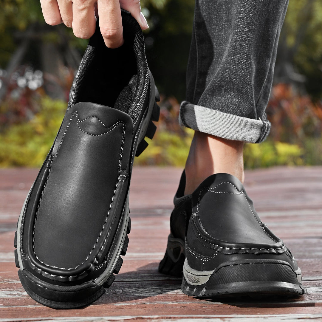 A pair of new men's orthopedic casual slip-on leather walking shoes