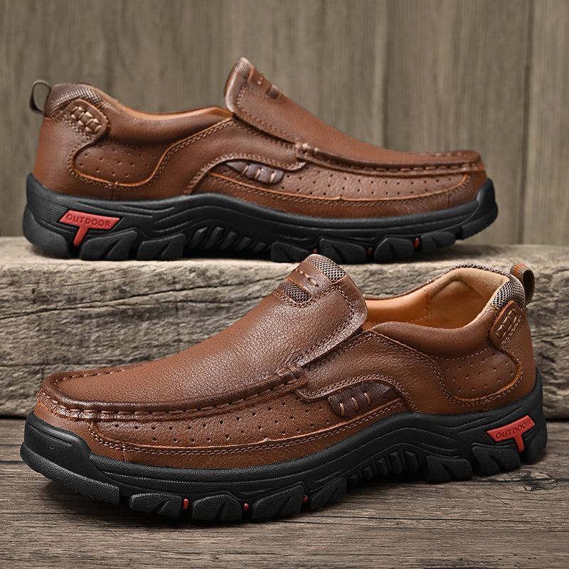 A stack of Men's Orthopedic Comfort Transition Boots in various colors, showcasing range of options