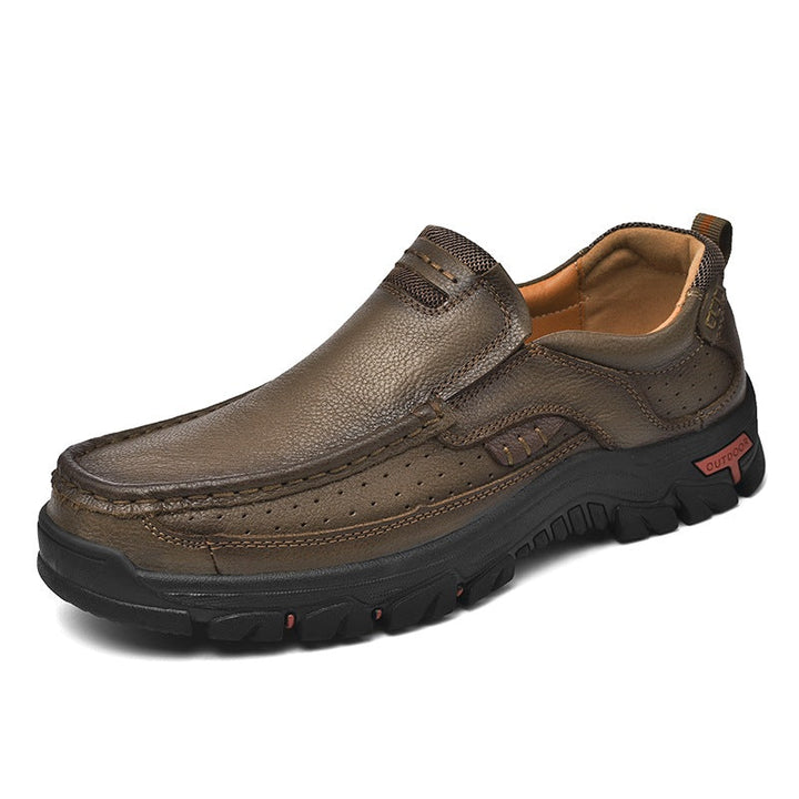 Close up of Men's Orthopedic Transition Boot, brown leather, showing detailed stitching and slip-resistant sole