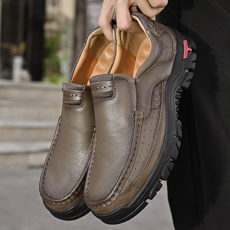Man wearing Men's Orthopedic Comfort Transition Boots, dark brown, walking outdoors, showcasing practical use