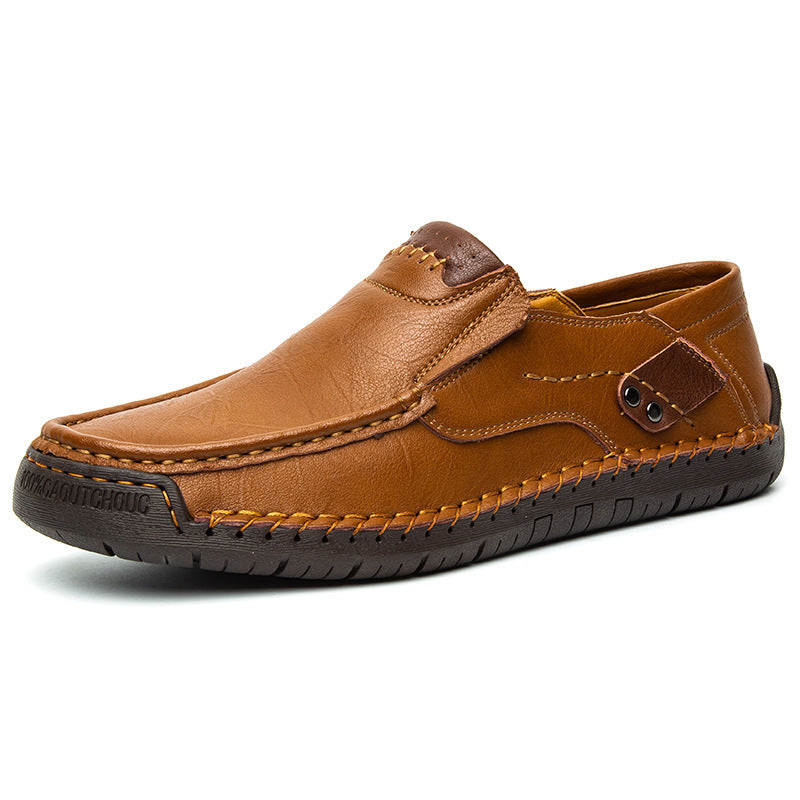 Close-up of men's hand-stitched leather comfort footwear, showing detailed stitching and quality material