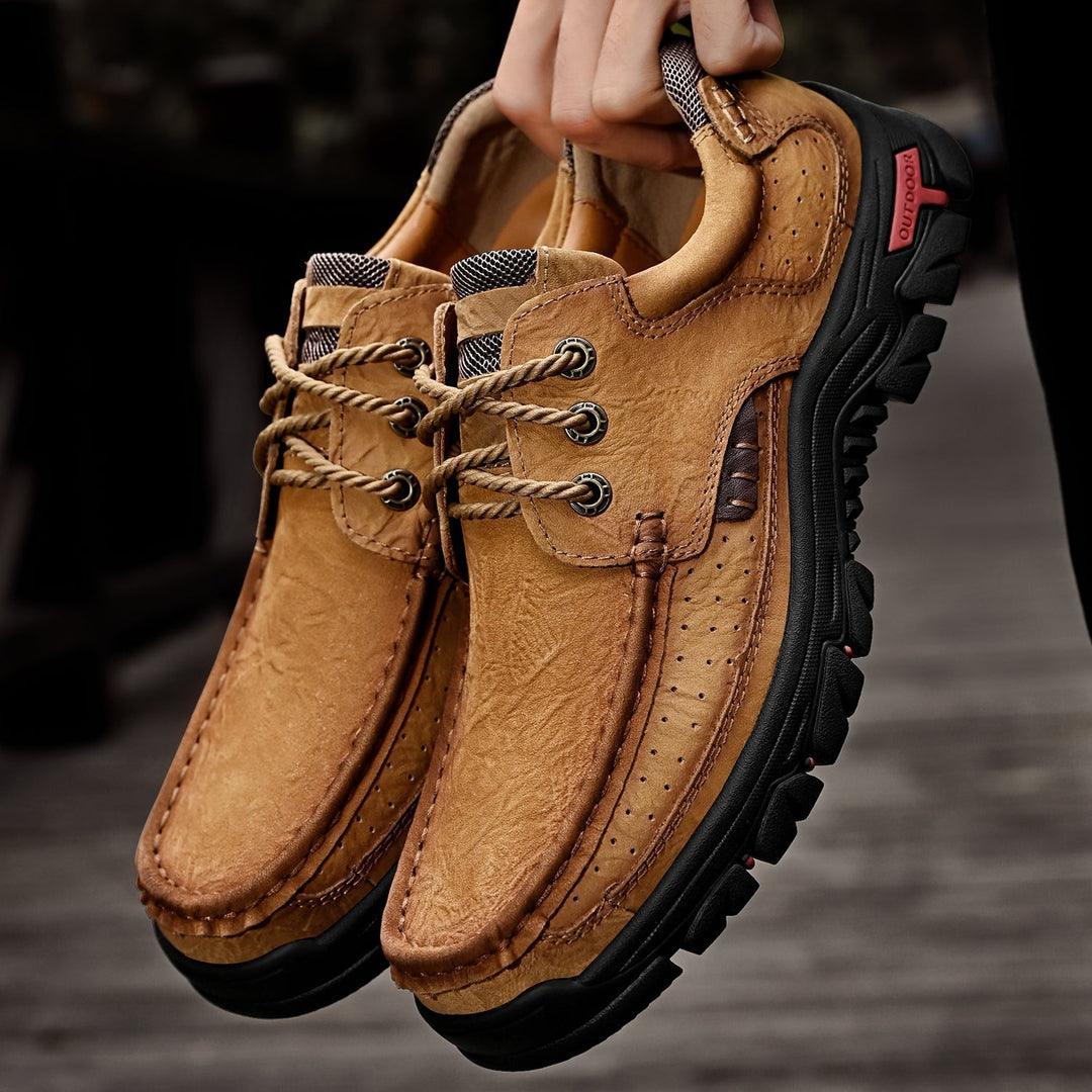 Close-up of men's orthopedic leather boots, detailed lacing, sturdy sole