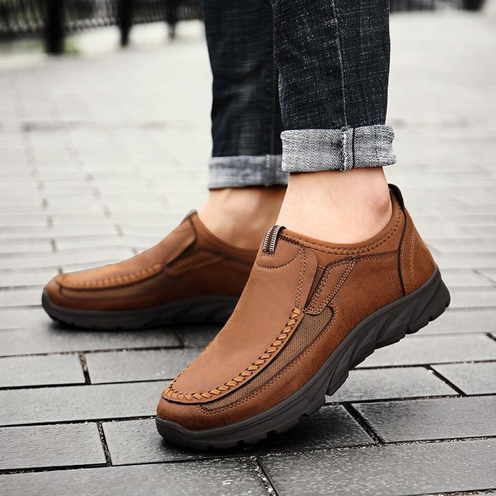 Close-up of the Men's comfort leather walking shoe, showing breathable stitching