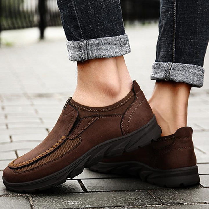 Top view of men's leather walking shoes, focus on round-toe and comfort