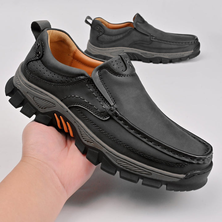 Two pairs of men's orthopedic boots, black and brown, comfortable and stylish footwear