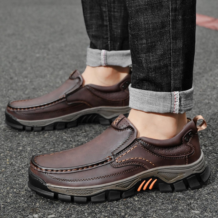 Orthopedic men's boots, brown leather, comfortable, styled for an outdoor autumn look
