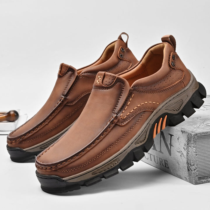 Detail of stitching on genuine leather men's orthopedic boots, comfortable and durable