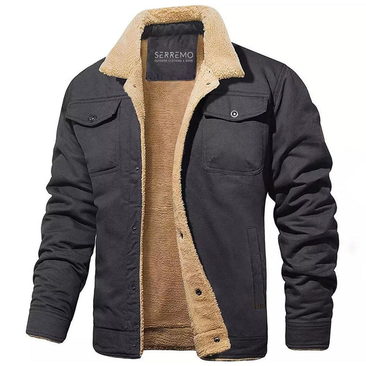 Close-up of men's adventure gear jacket, showcasing waterproof fabric and robust zipper details
