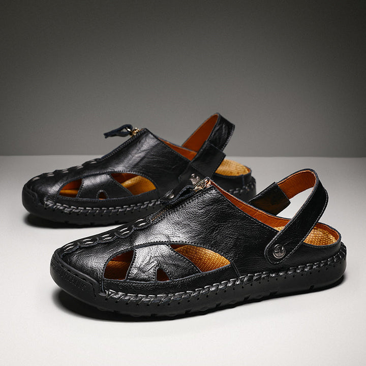 Men's outdoor closed-toe leather sandals on a sandy beach background