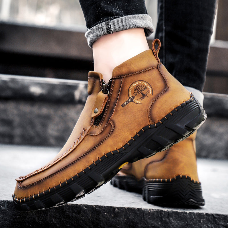 Close-up of the robust stitching on men's leather orthopedic work boots, quality finish