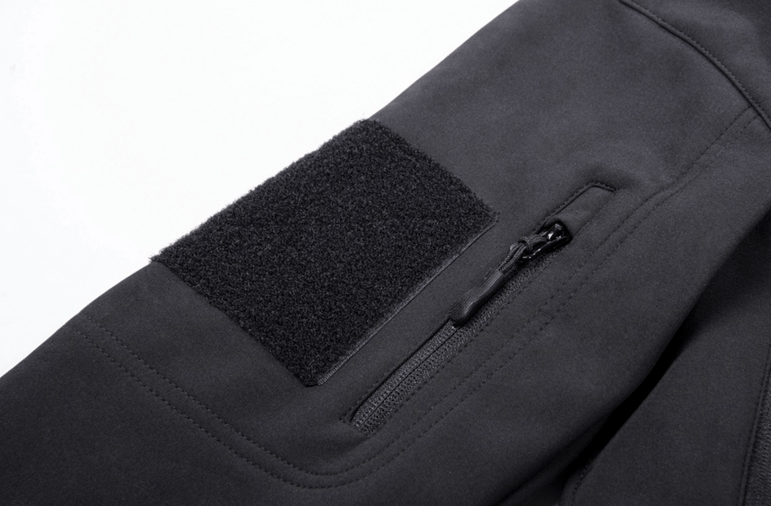 Zoomed-in shot of the waterproof zipper on a Men's Insulated Travel Jacket, essential for weatherproof protection