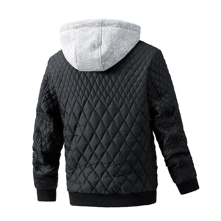 Close-up of a man's padded utility jacket showing durable fabric, sturdy zippers, and warm insulation detail