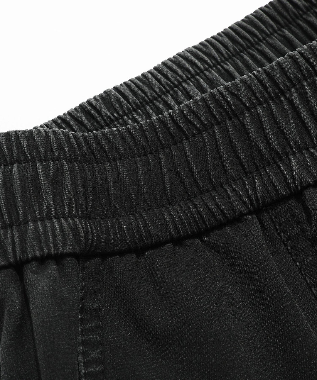 Man wearing Men's Performance Athletic Jogger Pants while jogging outdoors, emphasizing comfort & movement