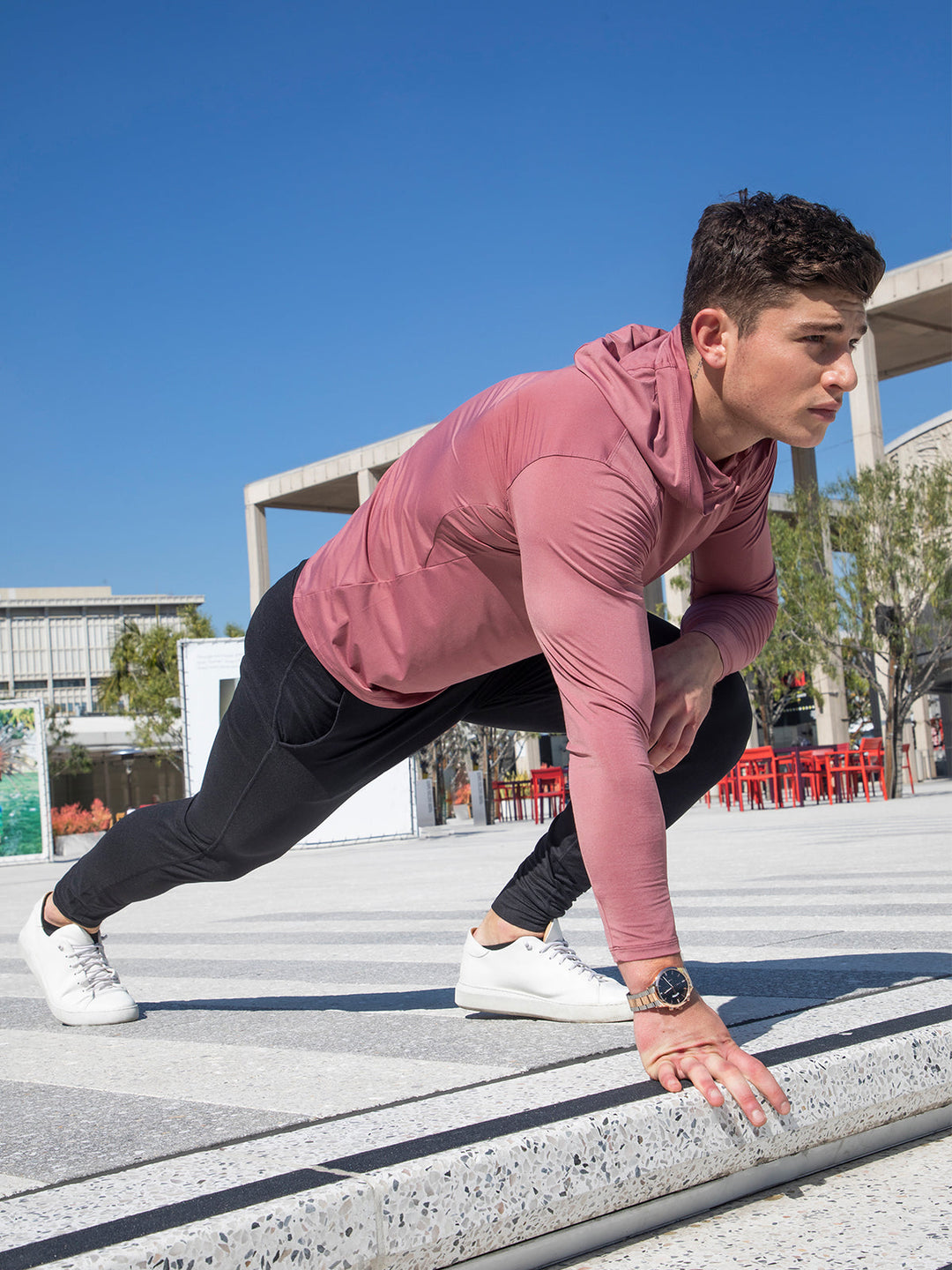 Men's black running hoodie showcased on a mannequin, ideal for cold weather training