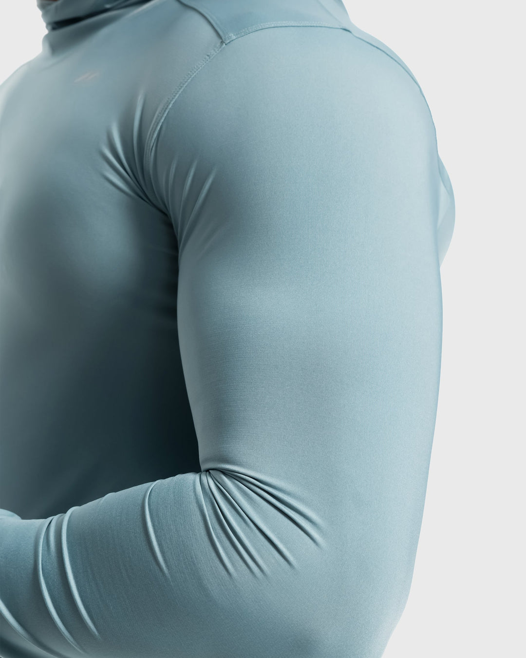 Men's activewear hoodie in dark grey, featuring subtle branding, versatile for gym & casual